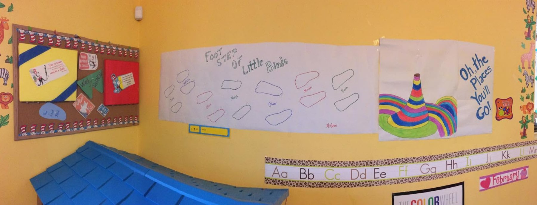 A “Footstep of Little Birds” bulletin board and a hand-painted “Oh the Places You’ll Go” piece